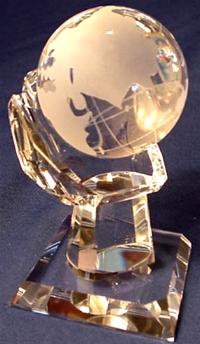 Crystal globe on crystal hand shape base